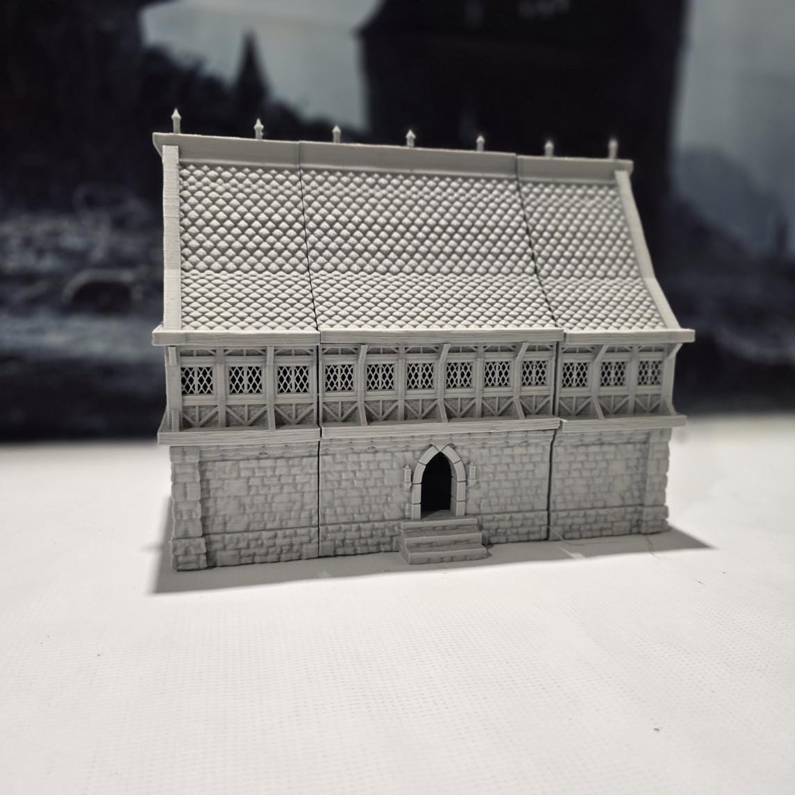 A detailed 3D-printed model of a modular warehouse for tabletop RPGs like DnD and Pathfinder. Features include brick walls, metal beams, storage crates, shelving units, and broken machinery. Perfect for urban and industrial gaming scenarios