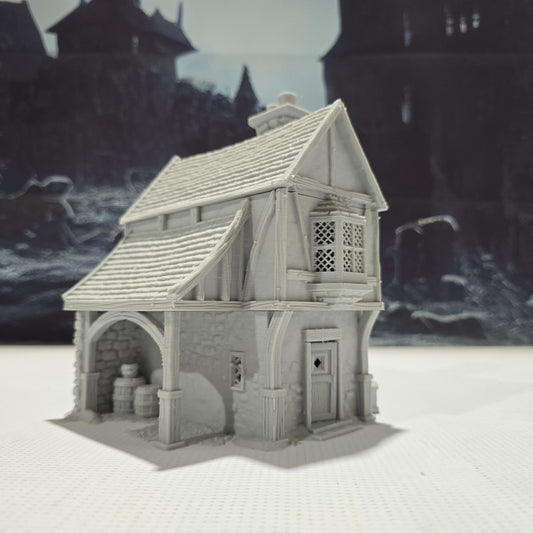 Briarwood House 5 model is a highly detailed medieval half-timbered house, showcasing a classic stone & timber structure. The design includes a steeply pitched roof, a stone chimney, & lattice windows, perfect for enhancing medieval tabletop games