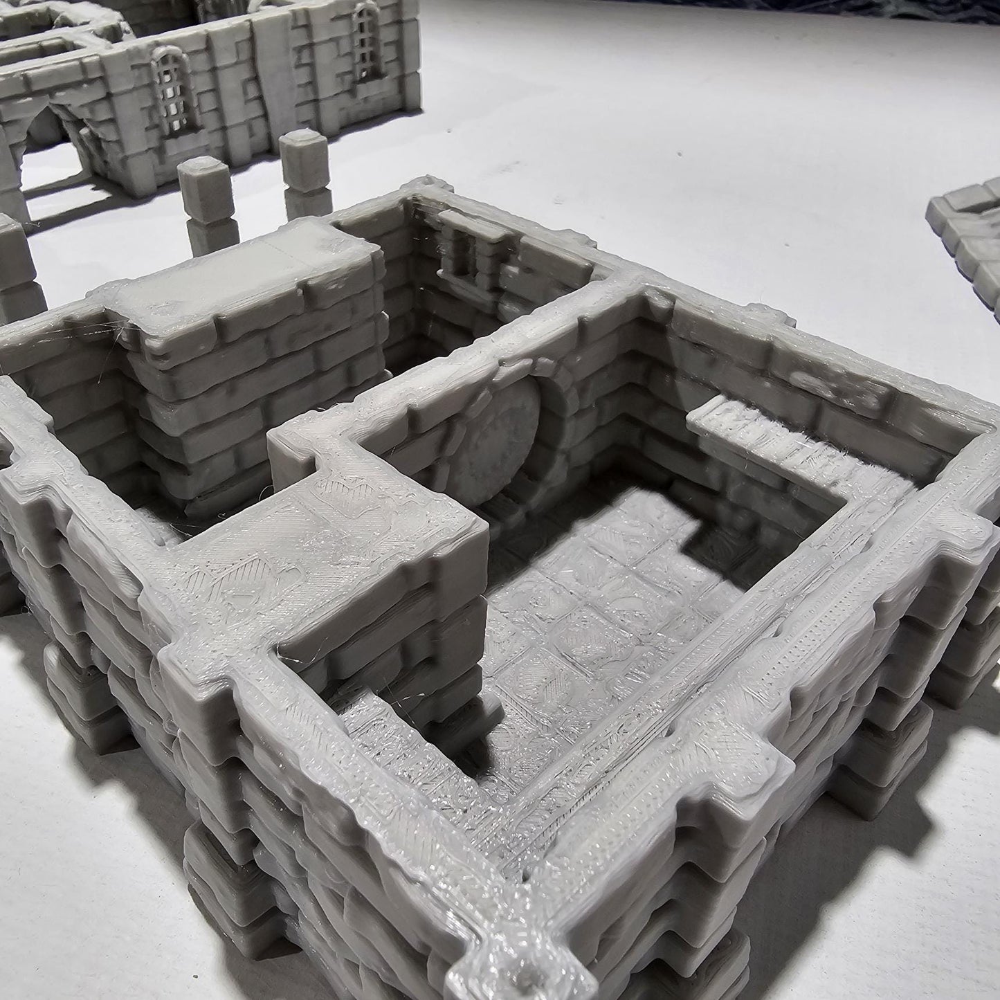 Detailed 3D-printed medieval city bank with stone walls, ornate columns, and banking hall, perfect for tabletop RPGs like Dungeons & Dragons and Pathfinder.