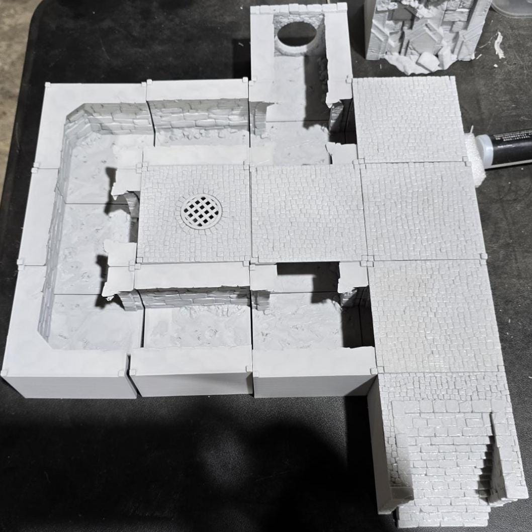 Detailed 3D-printed Ancrabourg Sewer System set for tabletop RPGs like DnD and Pathfinder. Features include intricate stone walls, water entries, manholes, and connecting tunnels. Ideal for adding depth and immersion to underground and sewer