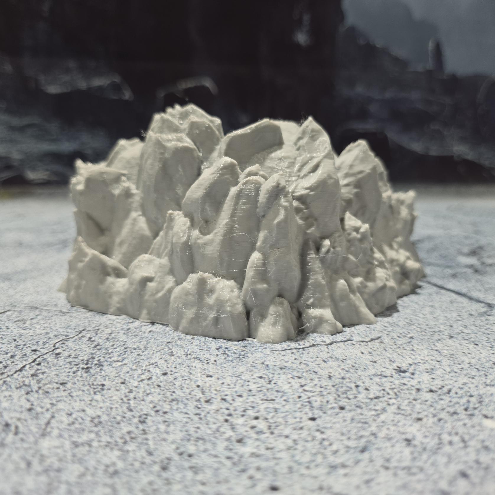 Discover the Drenn Cave Entrance, a detailed fantasy terrain piece featuring a weathered stone entrance guarded by ancient statues. Perfect for adding depth to your tabletop RPGs and wargames. Crafted from durable PLA