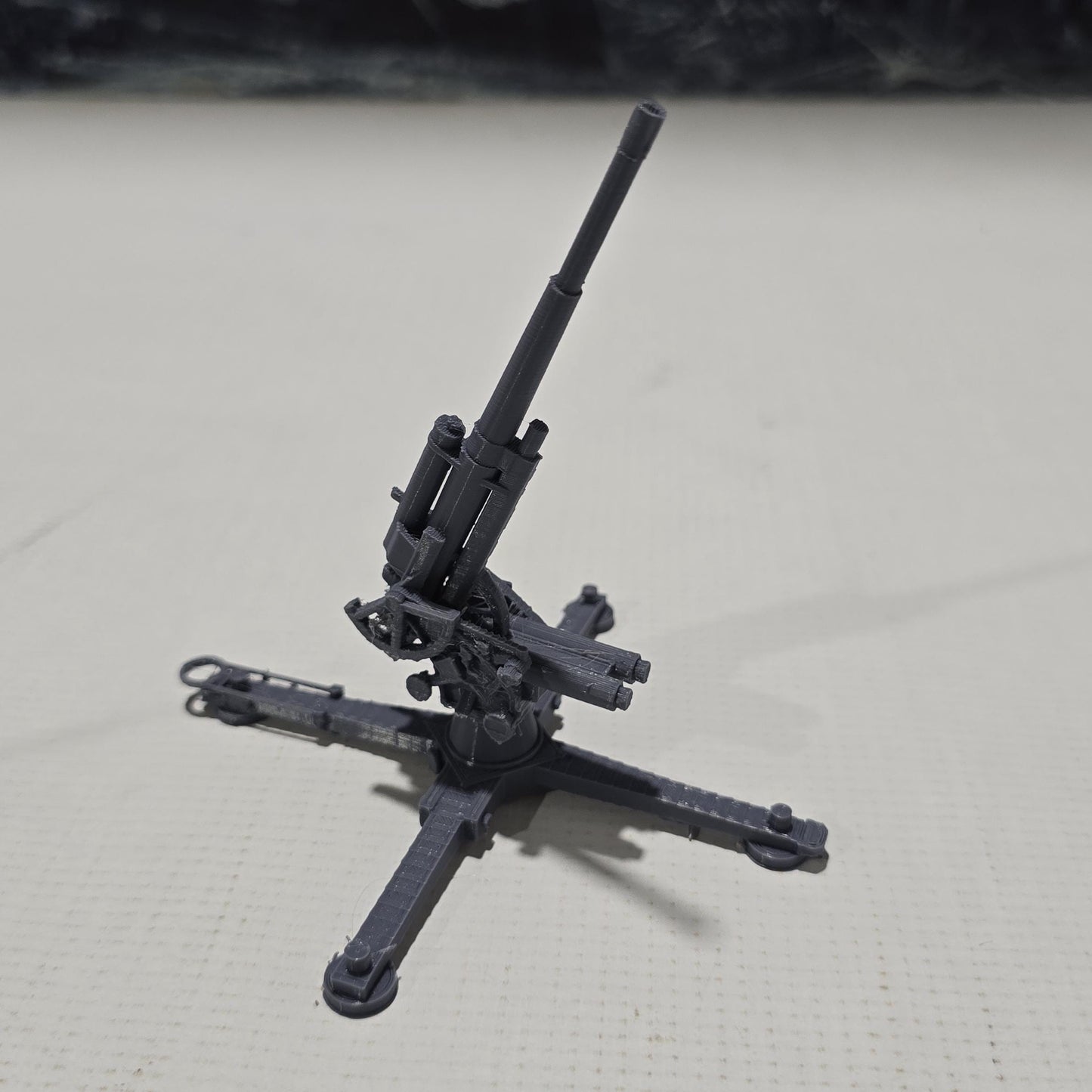 Detailed 3D-printed model of the WWII German Flak 18 heavy flak cannon, showcasing its rotating gun and adjustable barrel, perfect for enhancing your historical and fantasy tabletop gaming sessions.