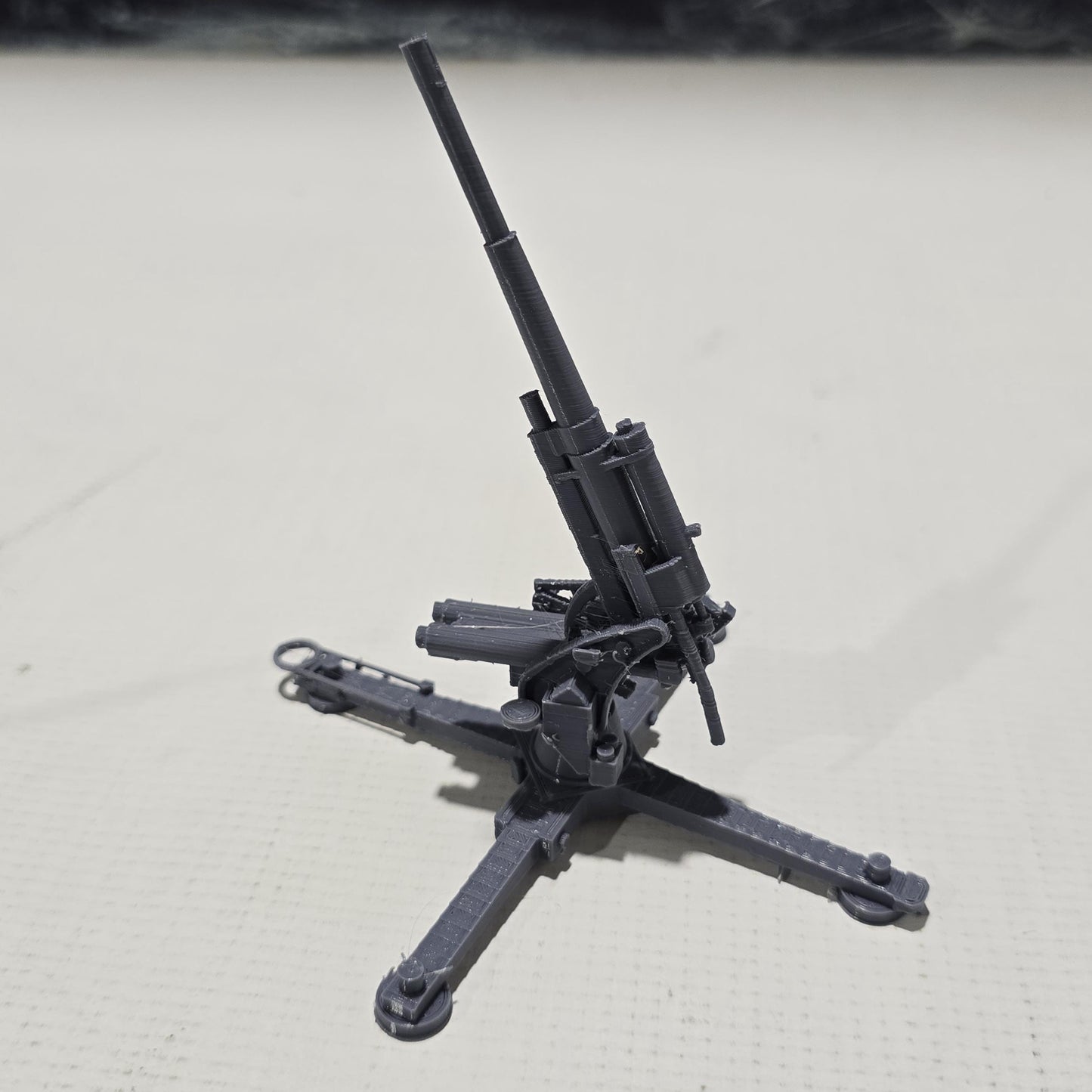 Detailed 3D-printed model of the WWII German Flak 18 heavy flak cannon, showcasing its rotating gun and adjustable barrel, perfect for enhancing your historical and fantasy tabletop gaming sessions.