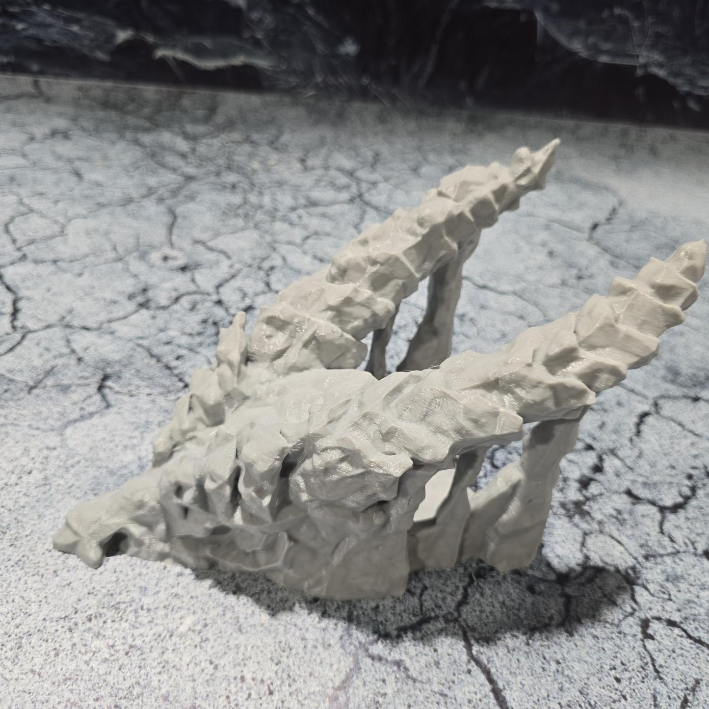 A meticulously crafted 3D model depicting a dragon&#39;s skull that serves as a cave entrance, set against a backdrop of ominous, dark castles and rugged terrains, perfect for enhancing medieval and fantasy-themed gaming sessions.