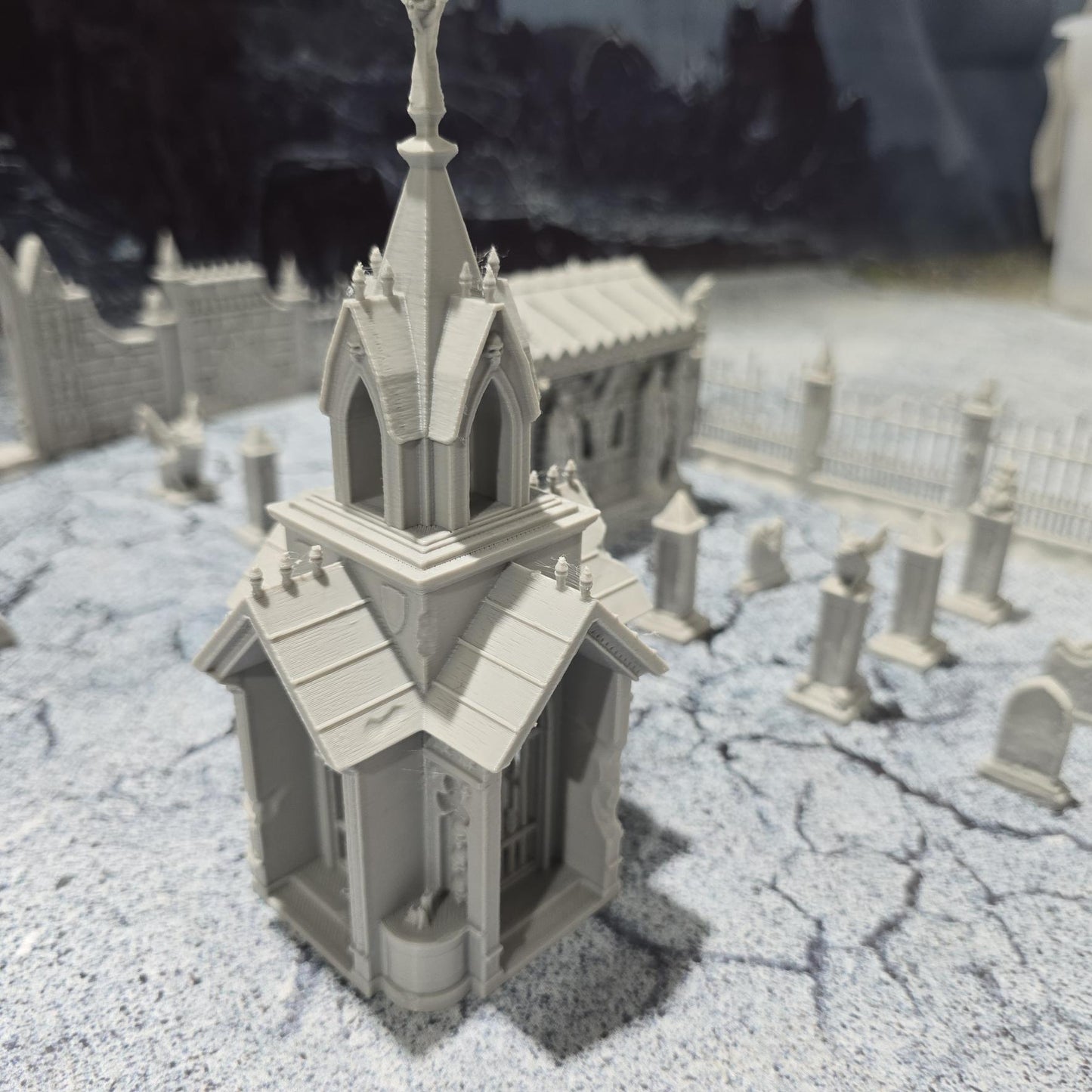 Explore the 19th-century Gothic revival with our Large Cemetery Set, featuring a chapel, 26 gravestones, gargoyles, and more for tabletop RPGs