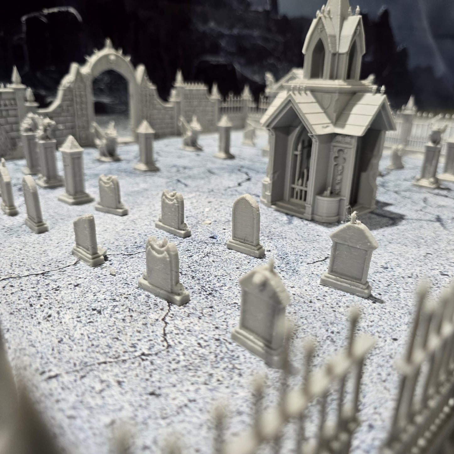 Explore the 19th-century Gothic revival with our Large Cemetery Set, featuring a chapel, 26 gravestones, gargoyles, and more for tabletop RPGs