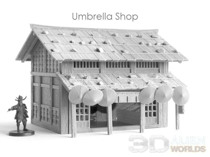 Detailed replica of a Samurai-era Umbrella Shop. Features traditional Japanese architecture with umbrella props, perfect for RPG settings.