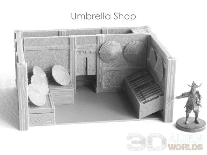 Detailed replica of a Samurai-era Umbrella Shop. Features traditional Japanese architecture with umbrella props, perfect for RPG settings.