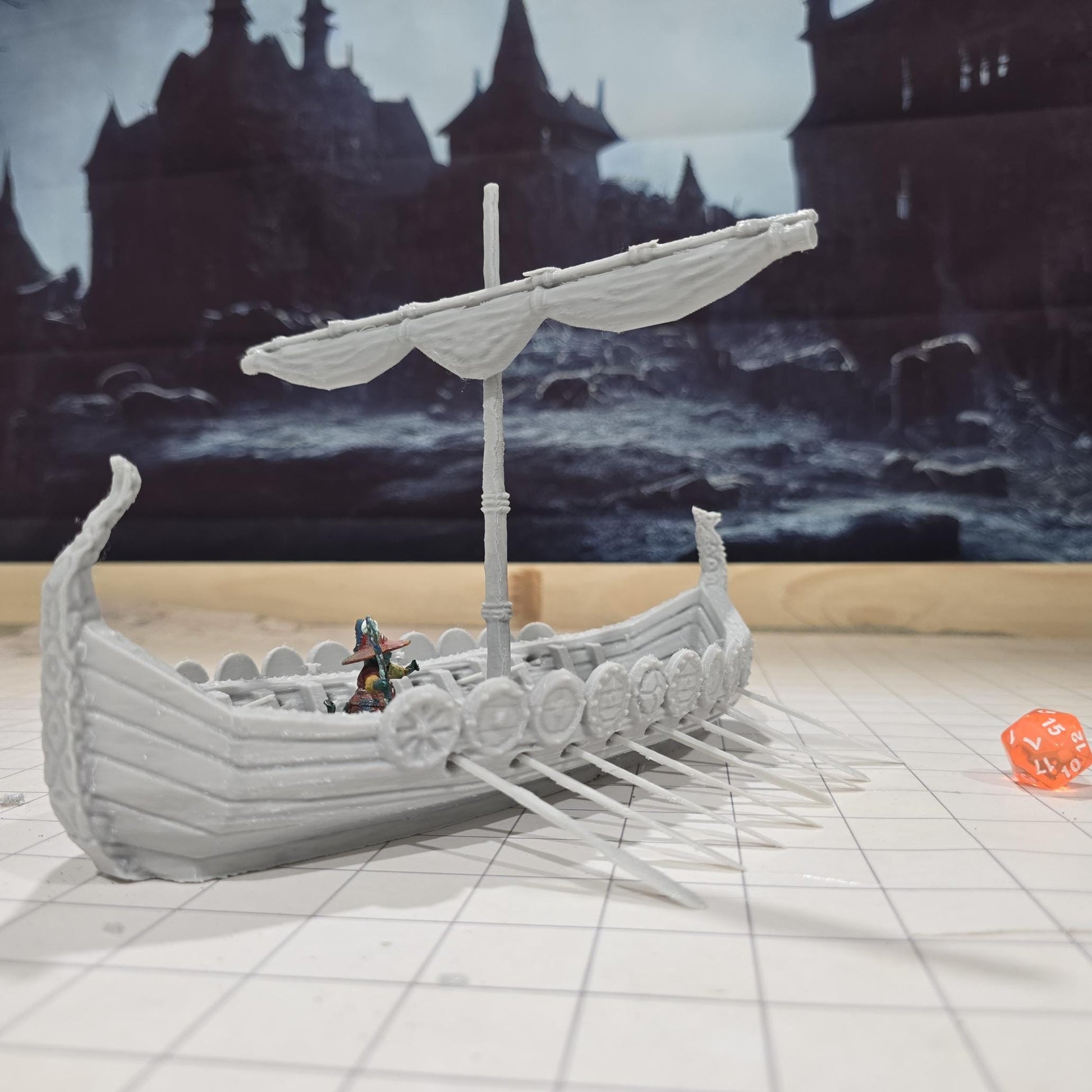 Detailed model of a Viking Long Ship with ornate carvings and shields, designed for use in tabletop RPGs and historical reenactments.